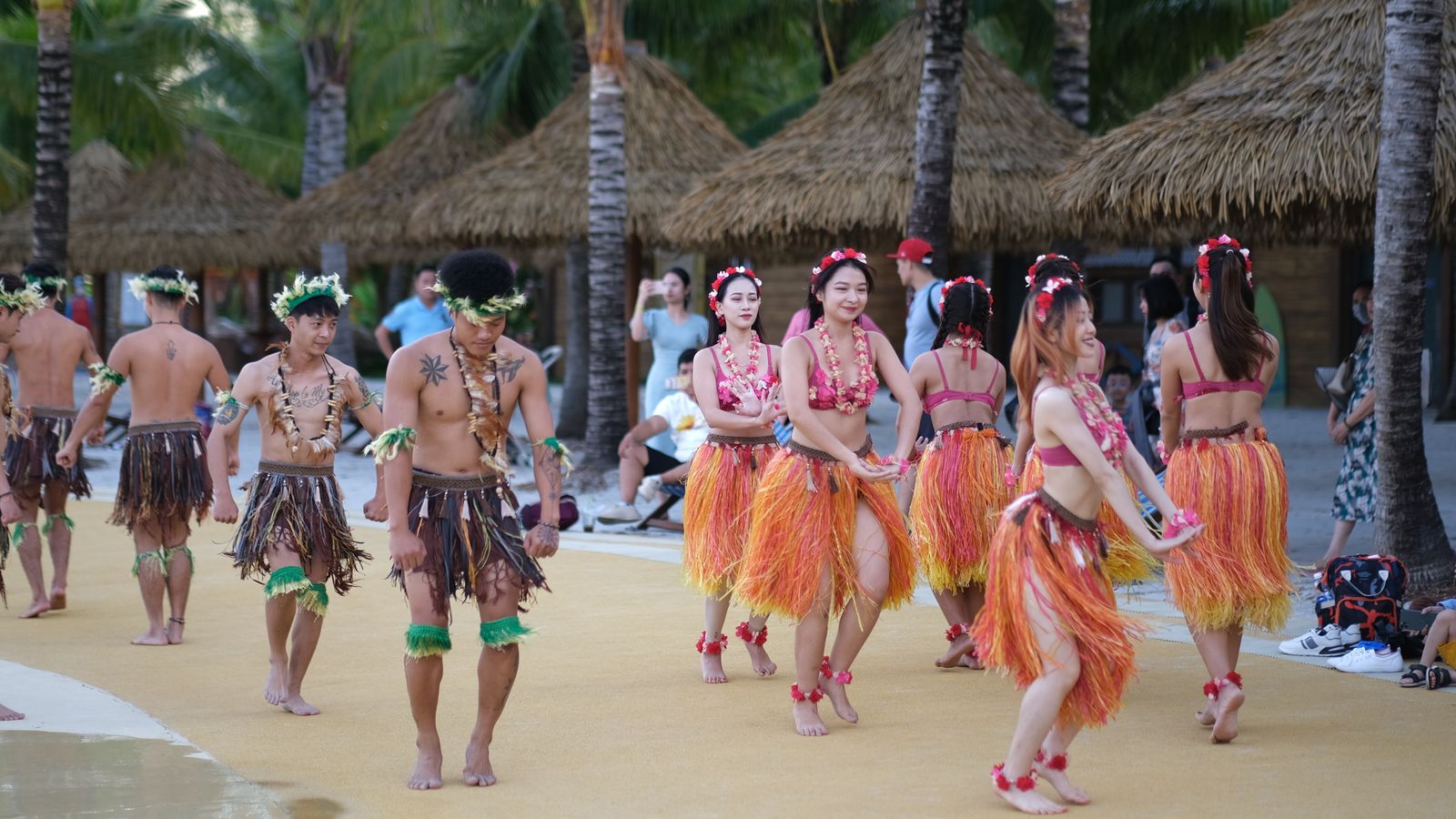 Dancers performing at a beachside luau